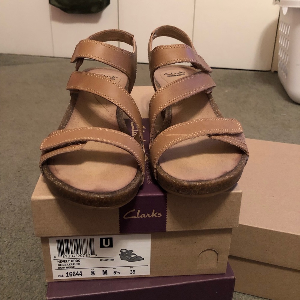Strapping tan wedges by Clark’s